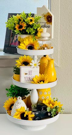 three tiered tray with sunflowers and photos