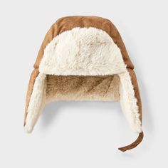 Keep your little one cozy all winter with this Suede Faux-Fur Trapper Hat from Cat & Jack™. This trapper hat is crafted from heavyweight fabric with faux fur and full lining, complete with functional ear flaps to keep the warmth in and the cold out. Plus, it features a chinstrap hook-and-loop fastener for a snug, stay-put fit. Cat & Jack™: Designed for all children so you can trust it's made for yours. Brown Hat With Plush Lining For Cold Weather, Adjustable Cap With Plush Lining, Plush Lined Cap For Cold Weather, Cold Weather Cap With Plush Lining, Adjustable Hats With Faux Fur Trim For Cold Weather, Adjustable Faux Fur Trim Hats For Cold Weather, Faux Fur Hats With Plush Lining For Cold Weather, Faux Fur Hat With Plush Lining For Cold Weather, Adjustable Faux Fur Trim Cold Weather Hats