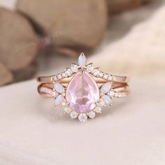 an image of a pink ring with diamonds on it