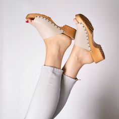 Beige Clogs With Wooden Heel And Open Back, Beige Clogs With Wooden Heel And Open Heel, Beige Open Heel Clogs With Wooden Heel, Beige High Heel Clogs With Stacked Heel, Beige Clogs With Stacked High Heel, Natural Sandals With Wooden Heel, Natural Color Heels With Wooden Heel, Beige Clogs With Wooden Heel And Round Toe, Beige Mules With Wooden Heel And Round Toe