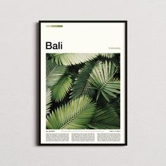 a magazine cover with palm leaves on the front and back pages, in black frame