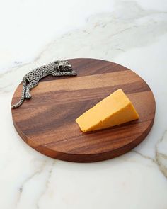 a cheese board with a cheetah on it