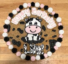 a birthday cake decorated with an image of a cow