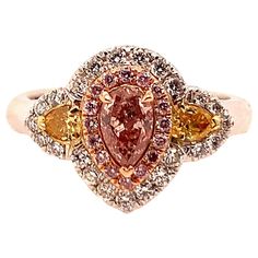 GIA Certified 0.38 Carat Natural Pink Diamond Cocktail Engagement Ring. The Ring is set with 23 natural colorless round diamonds, 16 natural round pink diamonds, and 2 natural intense orange-yellow pear shape diamonds, weighing 0.30 carats. Total weight of diamonds are 0.68 carats, total weight of ring is 7.83 grams (size 6.5). All diamonds are eye-clean, VS-I in clarity. 1940s Engagement Ring, Retro Engagement Rings, Diamond Sapphire Engagement Ring, Sapphire Diamond Engagement, Pink Diamond Ring, Contemporary Engagement Rings, Pink Diamonds, Platinum Diamond Engagement Rings, Jaune Orange