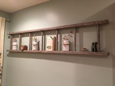 a shelf with candles and other items on it