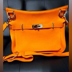 Here's Your Chance To Own A Piece Of Fashion History With This Stunning Hermes Jypsier 34 Handbag In Vibrant Orange. Purchased Back In 2010, This Bag Has Been Stored With Care And Has Never Been Used, Making It A Rare Find For Collectors And Lovers Of Luxury Fashion Alike. Condition: Pristine, Never Used .Color: Eye-Catching Orange, A Bold Statement Piece. Material: Luxurious Taurillon Clemence Leather, Known For Its Softness And Durability. Hardware: Palladium Plated, Adding A Touch Of Modern E Orange Travel Bag With Silver-tone Hardware, Luxury Orange Bags With Silver-tone Hardware, Orange Bags With Palladium Hardware, Orange Rectangular Bag With Branded Hardware, Luxury Orange Crossbody Satchel, Orange Rectangular Shoulder Bag With Branded Hardware, Orange Rectangular Bags With Branded Hardware, Orange Shoulder Bag With Branded Hardware For Everyday, Travel Shoulder Bag With Branded Hardware In Orange