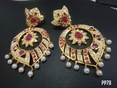 ✨🌟 Featuring a pair of gold plated JADAU CHANDBALI earrings studded with kundan polki, pearls, and navratna stones, set in copper. Perfect for festive occasions. 🌼🌟 Elegant Navratri Festive Earrings, Elegant Festive Earrings For Navratri, Elegant Round Earrings For Navratri, Elegant Kundan Earrings For Navratri, Elegant Round Danglers For Navratri, Fusion Gold Pearl Earrings For Festivals, Gold Fusion Pearl Earrings For Festivals, Festive Gold Fusion Pearl Earrings, Elegant Drop Earrings For Navratri