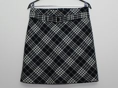 "Women's Black White Plaid Skirt Womens Wool Skirt Vintage 90s Mini Skirt Checkered Womens Skirt High Waist Skirt  Back to School Skirt Lined Medium Size  Fit size: MEDIUM Measurements(lying flat): Waist: 14.5\"/ 37 cm Length: 19\"/ 48.5 cm Please check measurements to insure a proper fit. Remember to allow yourself some extra room for movement. You can compare these with something from your closet that fits you well. Condition: Great Vintage Condition Material: 100% wool Lining: 100% polyester SHIPPING: * I ship worldwide via Priority mail (Latvijas Pasts) from Latvia (EU). * Items are shipped 1 - 5 business days after receiving the payment. * I ship from Europe, so please allow 3 to 4 weeks for the package to arrive if you live overseas. * Europe 7 - 10 business days. 1" Retro Mini Skirt For Workwear, Retro Mini Skirt For Work, Retro Mini Skort, Retro Relaxed Mini Skirt, Winter Retro Mini Skirt, Back To School Skirt, Black And White Plaid Skirt, 90s Mini Skirt, White Plaid Skirt