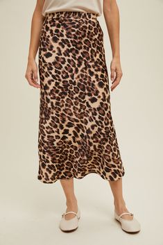 This midi length pencil skirt checks all the boxes and leans into our wild side!! With this leopard print, an elastic waist and a super silky fabric... its literally the perfect statement skirt to mix and match with all of your faves this season! xoxo 100% Polyester Small total length: 34 1/4" Free shipping on all orders over $75. Packaged with love and shipped from Shanty Boutique warehouse in Newport, Washington. For questions, call (509)447-3160, or visit us in-store at 137 S. Washington Ave. Leopard Midi Skirt, Satin Pencil Skirt, Statement Skirt, Cami Maxi Dress, Animal Print Skirt, Event Outfit, Satin Midi Skirt, Vintage Couture, Printed Midi Skirt