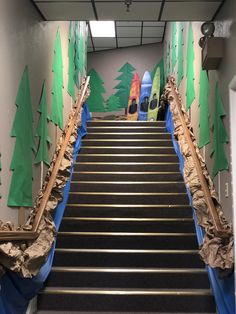 there is a set of stairs painted with trees and snowboards