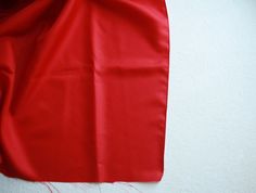 a red piece of cloth hanging on the wall