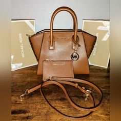 Authentic Michael Kors Avril Handbag With Removable Crossbody Strap And Wallet Set In A Gorgeous Saffiano Leather Color Called Camel Brown And Gold Hardware! This Set Is New Without Tags And Completely Blemish Free! Smoke Free Home And Fast Shipping! Offers Are Welcome Classic Brown Michael Kors Satchel, Michael Kors Brown Double Handle Satchel, Michael Kors Brown Shoulder Bag With Detachable Handle, Modern Brown Michael Kors Shoulder Bag, Formal Brown Michael Kors Bag, Michael Kors Rectangular Shoulder Bag In Cognac, Michael Kors Brown Bag With Removable Pouch, Michael Kors Rectangular Cognac Shoulder Bag, Michael Kors Cognac Satchel Shoulder Bag