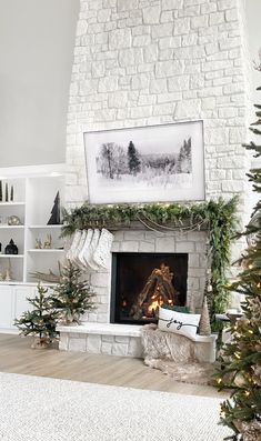 a living room decorated for christmas with white brick fireplace and stockings on the mantel