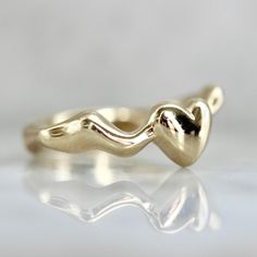 Why We Love it: Zahn-Z has come through with the ultimate friendship rings. Featuring a wavy silhouette with a bubbly heart, and aptly named for its ability to nestle together to create a seamless stack when you buy two (plus save 15% on the second when you add them to your cart!). Set in your choice of gold, this band is the perfect accessory to show off any kind of love. The Details: Available in 14k Yellow Gold, 14k White Gold, 14k Rose Gold Band Width is Approx. 6.50 mm at Widest and 2.30 mm Modern Wavy Jewelry For Anniversary, Modern Jewelry For Anniversary, Yellow Gold Wavy Ring For Anniversary, Anniversary Yellow Gold Wavy Rings, Wavy Yellow Gold Anniversary Rings, Heart Bubbles, Jewelry Wishlist, Heart Band, Friendship Rings