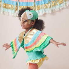 Little people love to pretend to fly, so this gorgeous parrot dress-up kit is the perfect gift to soar into their dressing up box! It includes two beautifully designed and crafted items - a winged cape with colorful fringed layering and a stunning headdress made from green velvet with glitter fabric and stitched features. Perfect to wear to parties or whenever dressing up appeals. 3-6 years. Layered fringed winged cape with popper fastener. Green velvet headdress with glitter elastic hook & loop Parrot Dress, Octopus Costume, Parrot Costume, Fringe Cape, Layered Fringe, Cape Costume, Party Girlande, Bird Costume, Dress Up Boxes