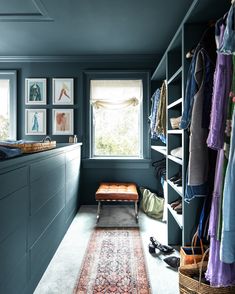 a room with blue walls and lots of closet space