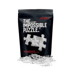 a bag of puzzle pieces sitting on top of a table