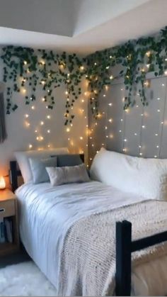 a bedroom with lights on the wall and a bed