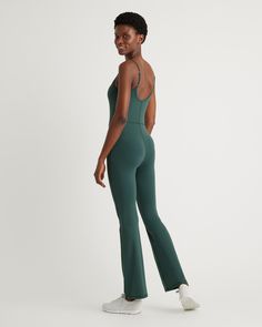 Update your activewear rotation with our Ultra-Form Kick Flare Jumpsuit. Designed for supreme comfort and versatility, this jumpsuit is perfect for low-impact workouts like yoga or just your day-to-day. The quick-drying, moisture-wicking, and anti-microbial properties keep you feeling comfortable. More things you'll love: the 4-way stretch, the adjustable spaghetti straps, a must-have flare leg, and an internal shelf bra with removable pads for support and coverage  | Quince | Women's Ultra-Form Athleisure Elastane Unitard For Pilates, Green Athleisure Bodysuit For Yoga, Green Sleeveless Jumpsuits And Rompers For Yoga, Sporty Yoga Jumpsuit, Green Sleeveless Jumpsuits And Rompers For Gym, Stretchy Elastane Jumpsuits For Sports, High Stretch Elastane Jumpsuits And Rompers For Sports, Athleisure Elastane Jumpsuits And Rompers For Gym, Sporty High Stretch Elastane Jumpsuit/romper