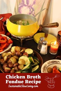 chicken broth fondue recipe on a table with candles and other foods in bowls