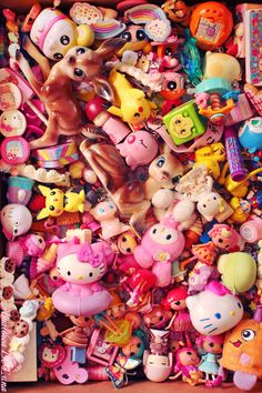 a box filled with lots of different types of toy figurines and toys on top of each other