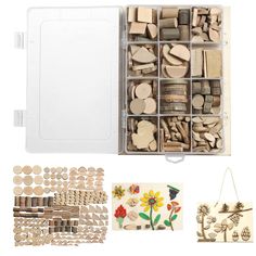 a box filled with lots of wooden pieces and magnets next to other crafting supplies