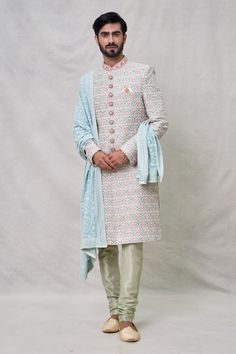 Green full sleeves sherwani with all over Lotus bloom thread embroidery using sequin highlights. Paired with a churidar and a bloom embroidered dupatta. - Aza Fashions Reception Long Sleeve Kurta With Multicolor Embroidery, Multicolor Embroidered Long Sleeve Kurta For Reception, Long Sleeve Multicolor Embroidered Kurta For Reception, Bollywood Sherwani With Multicolor Zari Embroidery, Bollywood Sherwani With Multicolor Embroidery And Zari Work, Bollywood Sherwani With Multicolor Resham Embroidery, Multicolor Embroidered Bandhgala With Traditional Drape For Festive Occasions, Multicolor Embroidered Bandhgala For Festive Occasions, Unstitched Multicolor Embroidered Sherwani