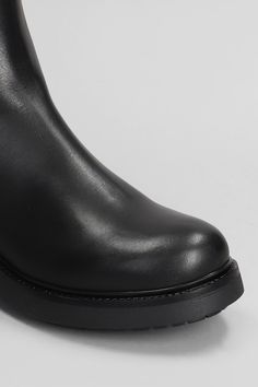 Combat boots in black leather, round toe, slip on, side elastic band, front tie rod, pull tab on backside, rubber sole, heel 4,5, Made in Italy Calf Leather Chelsea Boots With Heel Pull Tab, Sleek Black Chelsea Boots For Business, Black Chelsea Boots With Lug Sole In Calf Leather, Black Calf Leather Chelsea Boots With Lug Sole, Black Chelsea Boots With Lug Sole For Formal Occasions, Black Calf Leather Heeled Boots With Rubber Sole, Black Calf Leather Heeled Boots With Heel Pull Tab, Black Leather Knee-high Boots With Lug Sole, Slip-on Boots With Reinforced Heel In Calf Leather