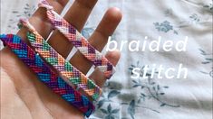 a hand holding three different colored bracelets on it's fingers with the words braided