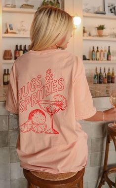 All we want is a spritz please! This peachy tee with a cherry red font has us ready for any fun spring get together. Maggie is 5'3" and is wearing size XL for an oversized look Heather is 5'9" and is wearing size medium sizing guide: Bella Canvas small: 36” bust | 28” length medium: 39" bust and 28.5" length large: 42” bust | 30” length extra large: 46” bust | 30.5” length extra extra large: 52” bust | 31.5” length 50% polyester 25% cotton 25% polyester fits true to size - size up for an oversiz Negroni Art, Bridal 2024, Work Fits, Team Board, 2024 Trends, River Rock, Tropical Vibes, Swim Accessories, Cherry Red