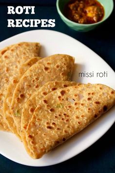 four tortillas on a white plate with the words missi roti