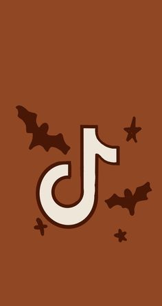 the letter j is made up of bats on a brown background with white letters and black stars