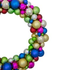 a christmas wreath made out of balloons on a white background with the letter o in the middle