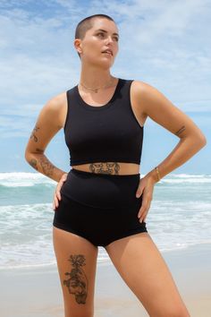 The ultimate second layer of sun protection for effortless style, our black ribbed crop top is double-lined and quick drying for a seamless transition from beach to gym to yoga mat. Pair with our award-winning Betty Bottoms or any high waist surf bottoms for a sleek and versatile look. This is made by our team in Australia High Waist Swim Shorts, Surf Shorts, Swimming Activities, Swim Short, Seamless Transition, Surf Wear, Ribbed Crop Top, The A Team, Black Rib