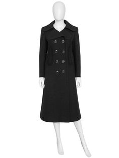 "A spectacular Pierre Cardin coat from the late 1960s. Made of a deep black wool fabric, featuring a clean, sharp cut with a double-breasted closure with the original silver-tone elliptical buttons, large geometrical soft black suede appliqués at the waist that run around the back as well as decorative stitching. Hidden side pockets. Midi-length. The coat is warm and perfect for fall and winter. Fully lined. Made in France. Condition Excellent, no flaws. Size No tag, will fit a D 34-36, F 36-38, Late 1960s, Decorative Stitching, Coat Black, Deep Black, Pierre Cardin, Space Age, 1960s Vintage, Wool Fabric, Soft Black