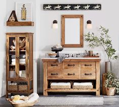 a bathroom with a wooden cabinet and mirror