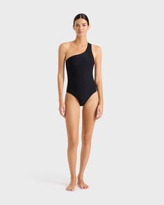 The Colette one shoulder swimsuit in Black is a signature Bondi Born style. Made using our unique Sculpteur® fabric with 3-D stretch, this elegant, classic one piece will never go out of style. Colette shapes the waistline and supports the bust with invisible under-bust support. The scooped out back adds a dramatic and sensual edge. This supportive and flattering piece suits cup sizes B to E. Luxury fabric sustainably made in Italy.Garment sustainably made in Australia. Skin Line, One Shoulder Swimsuit, Matte Fabric, Luxury Fabric, Cup Sizes, Signature Collection, Luxury Fabrics, Out Of Style, Go Out