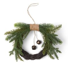 a wreath with two bells hanging from it's side on a white background,