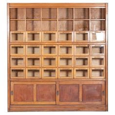 an old wooden bookcase with glass doors