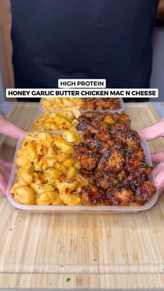 a person holding a tray full of macaroni and cheese with the caption high protein honey garlic butter chicken mac n cheese