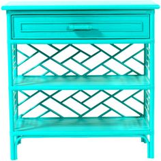 a blue nightstand with two drawers on each side and an open drawer in the middle