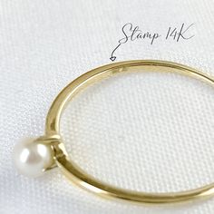 Elegant and timeless, mini Akoya pearl solitaire ring handcrafted in 10K solid yellow gold. Make it a treasure to yourself. Ships within 3 business days. - Stone info: 1pc of 3 to 3.5mm size mini genuine Akoya pearl - Band width: 1mm - The ring sits 4.45mm on the finger. - Made in 10 karat gold - Stamp with 10K. Classic 14k Gold Pearl Ring With Round Band, Classic 14k Gold Solitaire Pearl Ring, Stackable 14k Gold Pearl Ring With Round Band, Classic Stackable Pearl Ring, Classic 14k Gold Stackable Pearl Ring, Stackable 14k Gold Pearl Ring Gift, Classic Gold Pearl Ring, Akoya Pearl Ring, Akoya Pearls