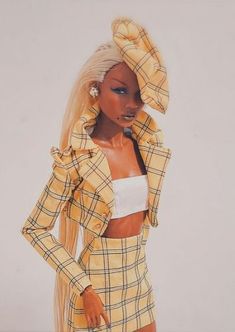 a barbie doll wearing a yellow plaid outfit and matching hair is standing in front of a white background