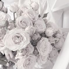 a bouquet of flowers sitting on top of a white chair