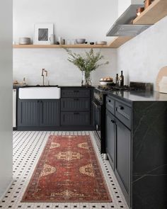 an instagram page with a black and white rug in the middle, on top of a kitchen