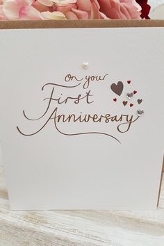 a card with the words on your first anniversary