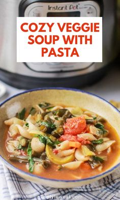 a bowl filled with pasta and vegetables next to an instant pot