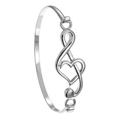 PRICES MAY VARY. Stylish and Elegant -- Music note bracelet will make a stunning musical statement and special treat for you or a favorite music lover, music teacher or musician friend Classy Style -- Treble clef bracelet with heart and hook closure comes in a PammyJ gift box with a protective sleeve, great for gift giving Sizing -- Music bracelet measures 2 ¼ inches and will fit up to a 7 inch wrist Gift For Musician -- for women, girl, or teen musician for their birthday or celebration of an a Treble Clef Heart, Music Note Bracelet, Music Designs, Music Bracelet, Twist Jewelry, Gift For Musician, Heart Bangle Bracelet, Wire Wrap Jewelry Designs, Womens Bangles