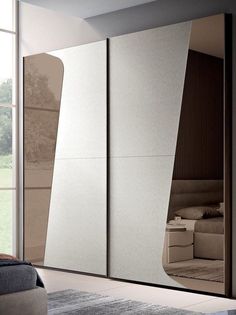 a bedroom with a large white and brown closet