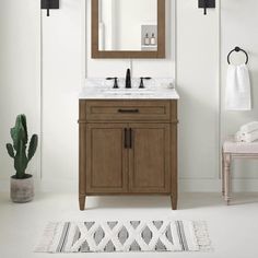 a bathroom with a sink, mirror and rug on the floor in front of it